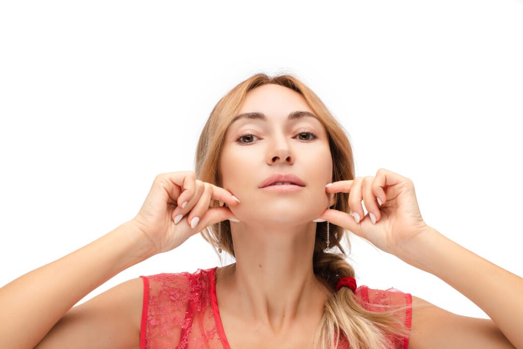 portrait young caucasian female with medium fair hair is braided pony tail with beautiful clear skin anti wrinkle exercises